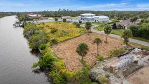 Prime Canal Lot: Scenic Views, Quick Boat Access, Nearby Shopping